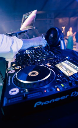 a-person-working-on-a-dj-turntable.jpg a person working on a dj turntable